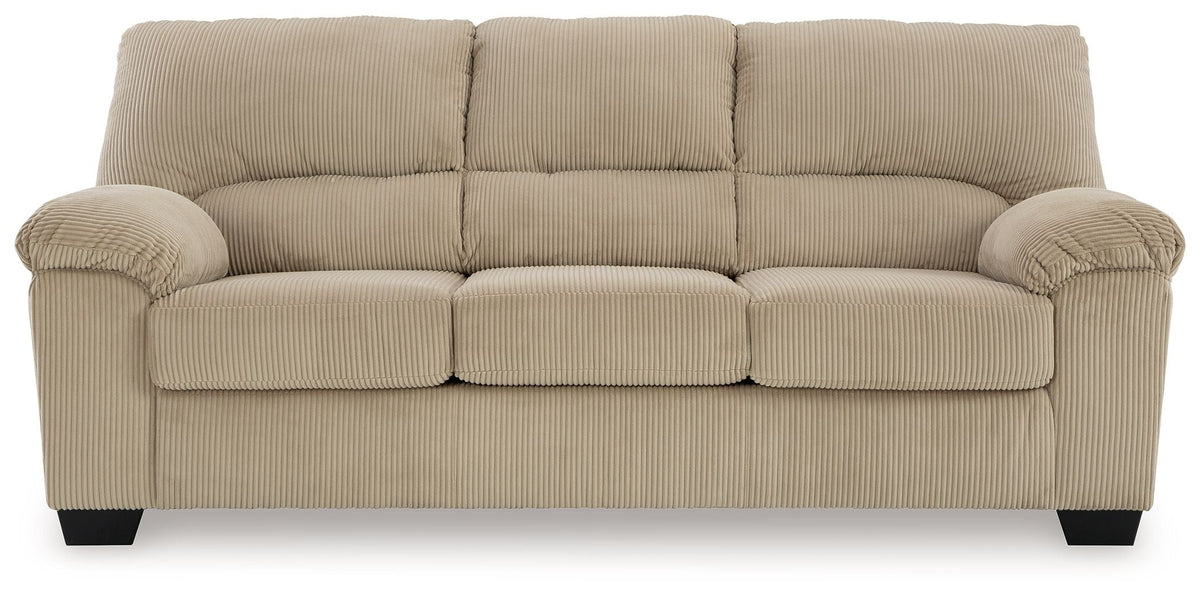 Beige sofa with tufted back cushions and rolled arms