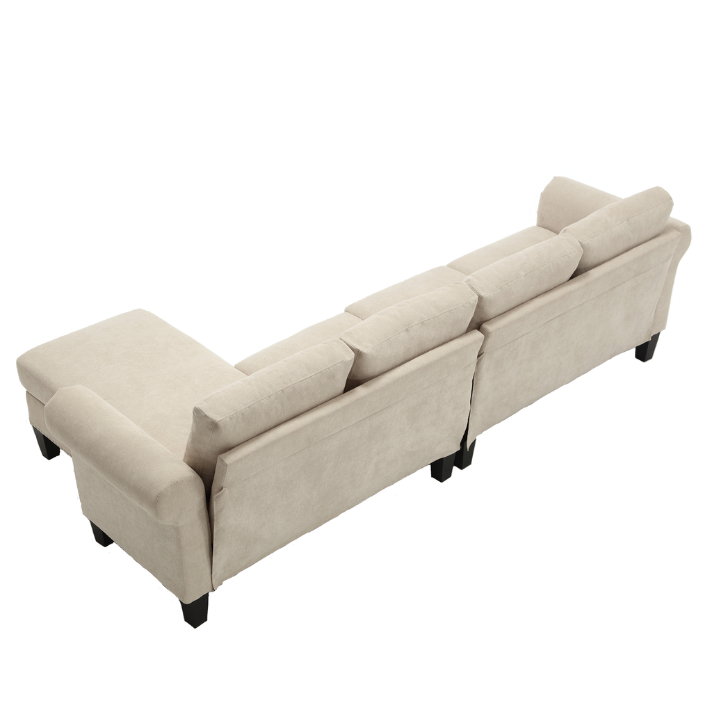 Beige sectional sofa with chaise in a low-angle view and tufted cushion blocks.