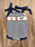 Navy-and-white striped baby romper with character applique and navy ribbon shoulder ties