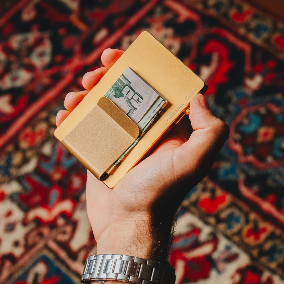 Beige pop-up cardholder open with card and cash compartments visible.