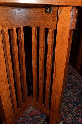 Detail view of slatted side panels on a wooden spindle plant stand