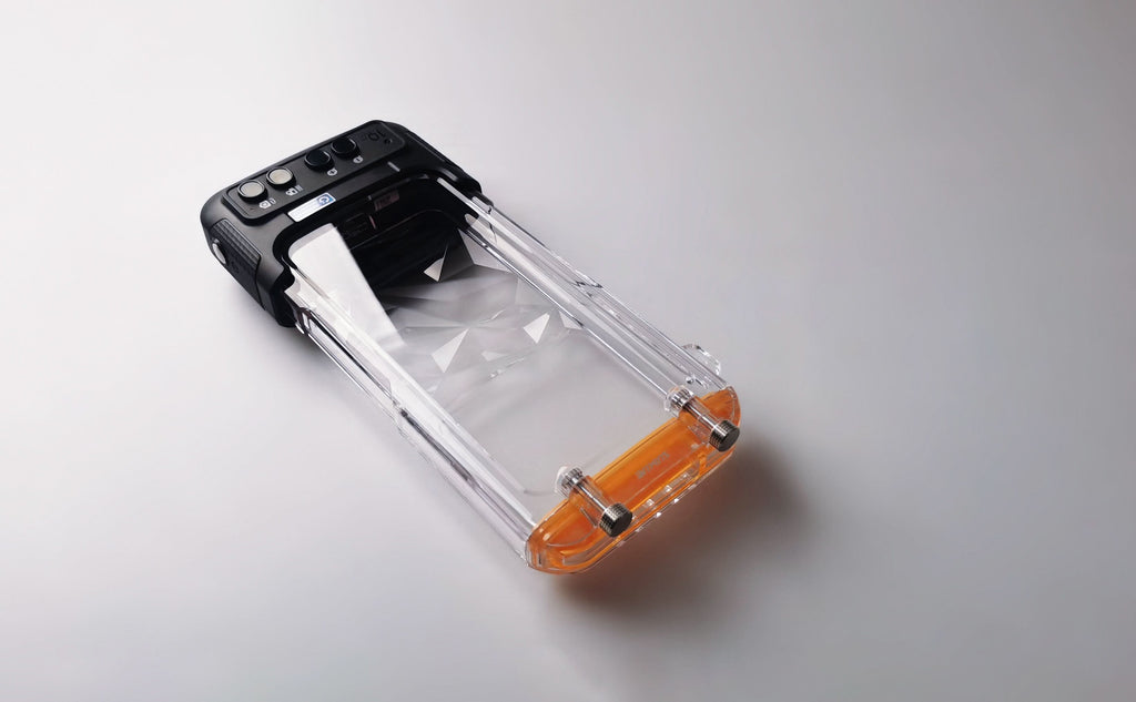 Clear waterproof phone case with orange top seal and black protective base