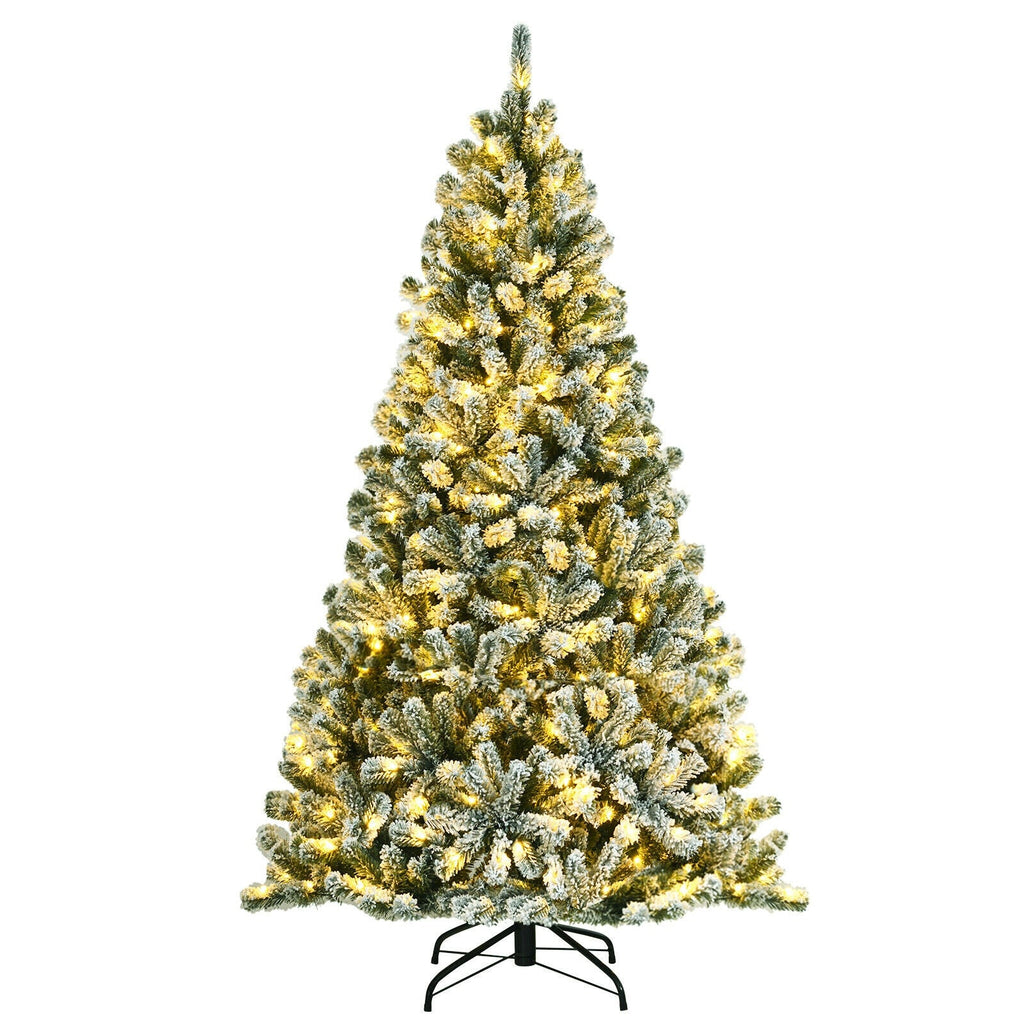 Pre-lit snow flocked Christmas tree with warm yellow lights and metal stand, standalone