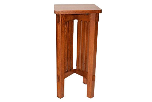 Full view of wooden spindle plant stand with square top and sturdy corner feet