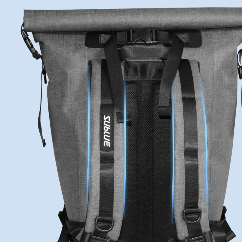 Gray waterproof roll-top backpack with blue-lined interior straps and buckle closure