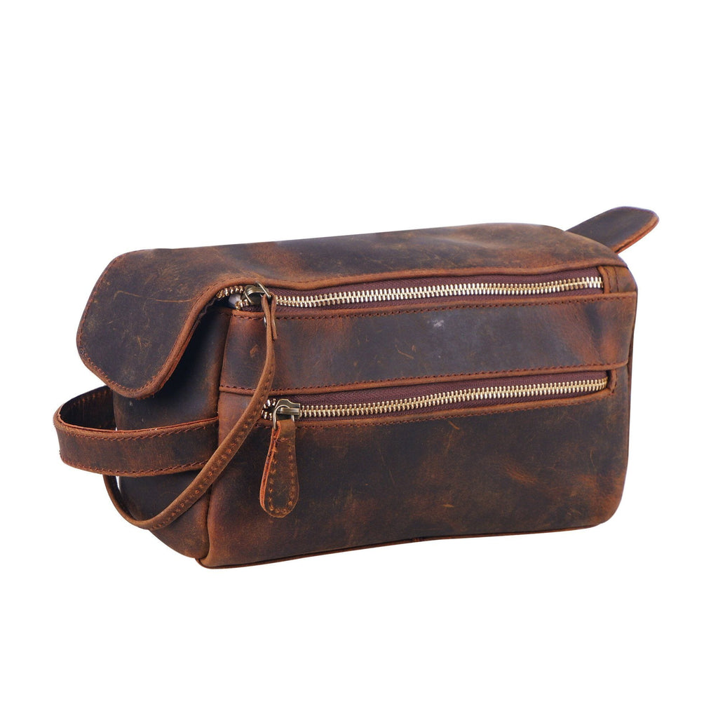 Brown leather travel dopp kit with top handle, flap, and dual zip compartments