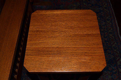 Top view of warm wood square tabletop on a spindle plant stand