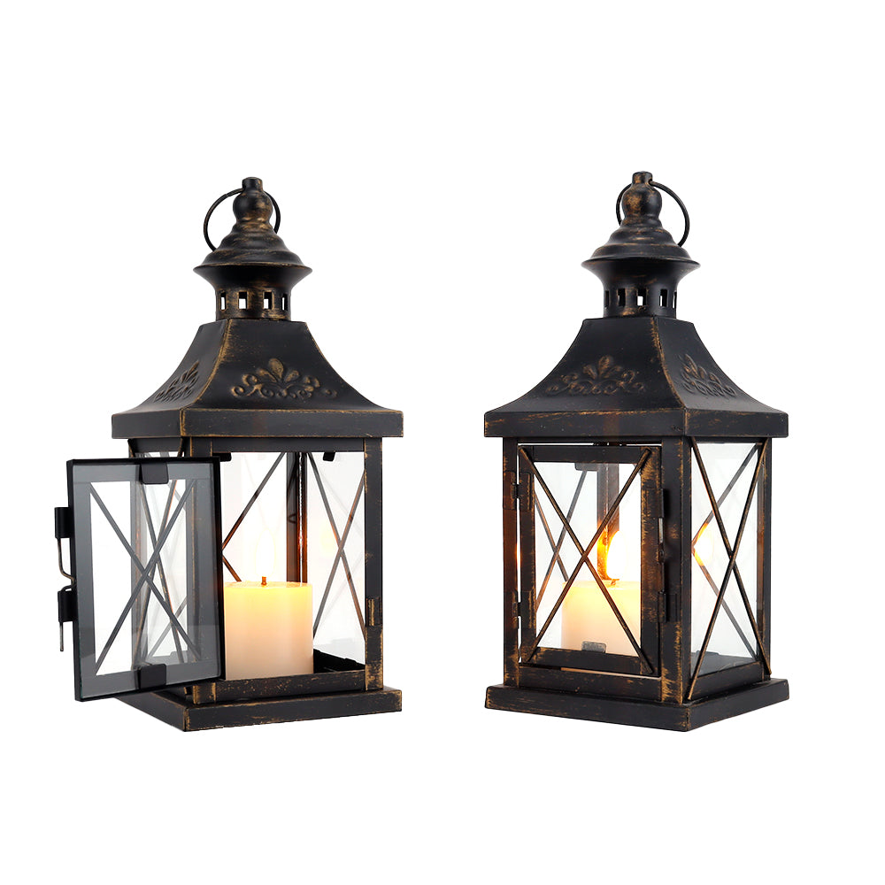 Pair of black metal hanging candle lanterns with glass panels and arched tops