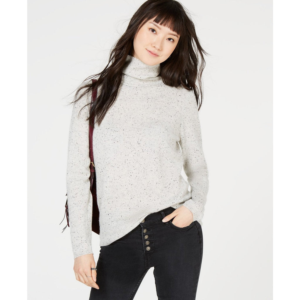 Ice grey heather speckled cashmere turtleneck sweater on model, fitted long sleeves