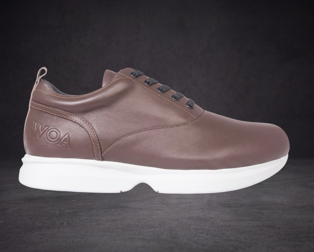 WOA brown low-top sneaker side profile with WOA emblem and white sole