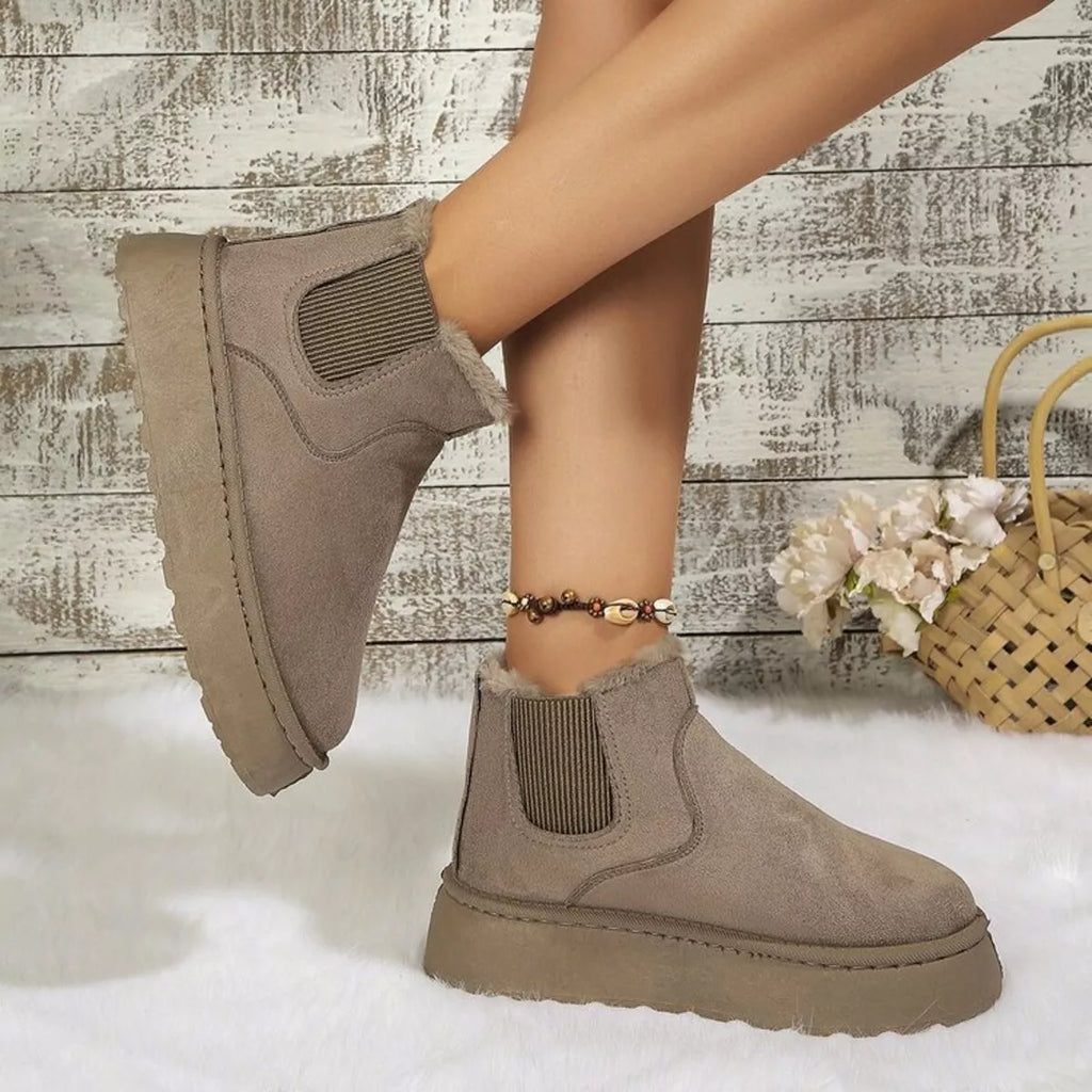 Beige platform ankle boots with round toe, elastic gore, and thick sole