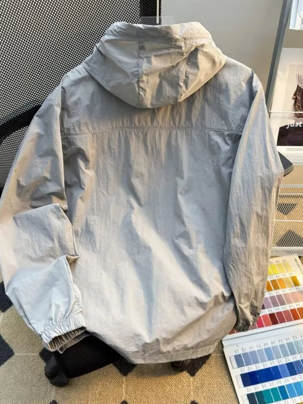 Men's plus size lightweight hooded windbreaker jacket, light grey, back view