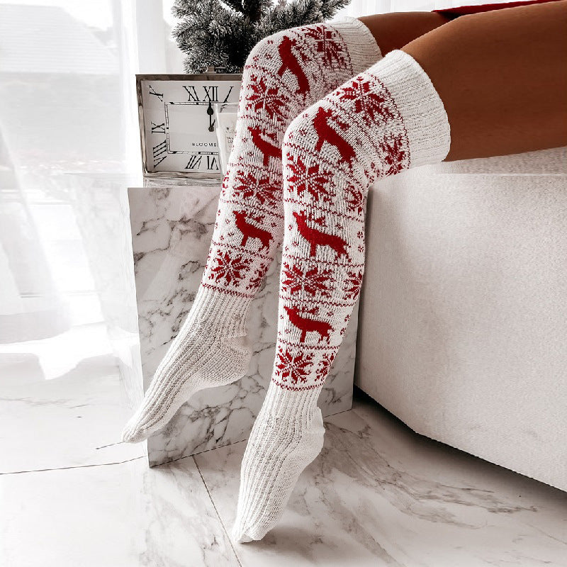 Women’s over-the-knee knitted Christmas socks in white with red reindeer and snowflake jacquard