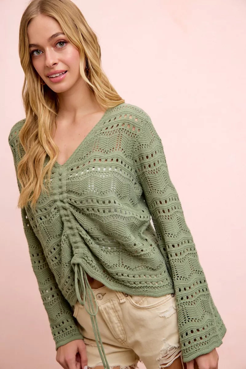 Sage green pointelle knit V-neck ruched front top with long sleeves and drawstring ties