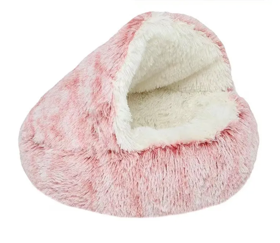 Pink semi-closed cat bed with plush outer shell and soft cream inner cushion