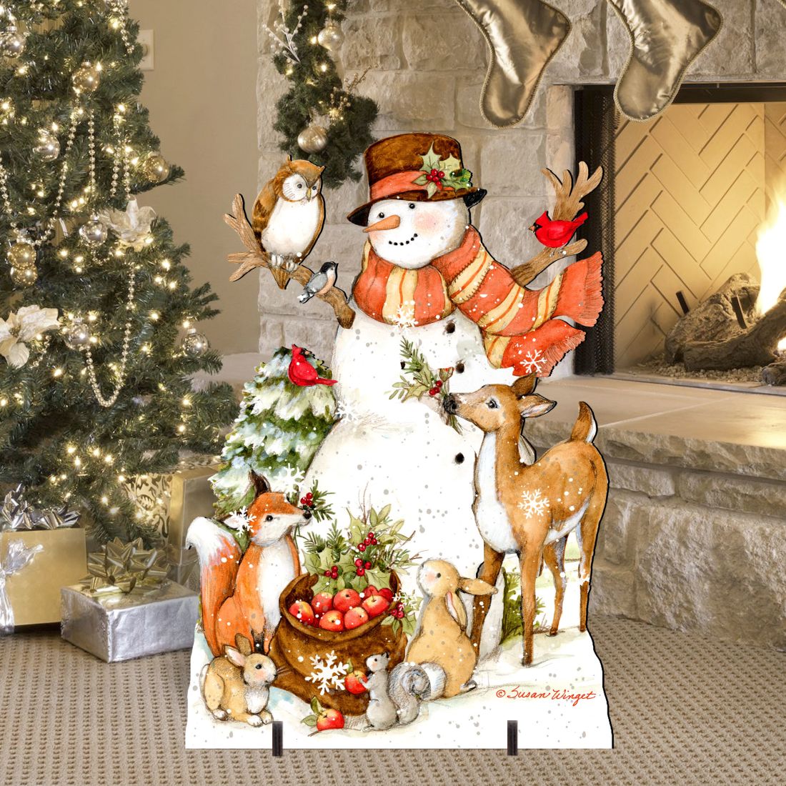 Outdoor yard sign featuring smiling snowman in orange scarf, deer, bird, and rabbits