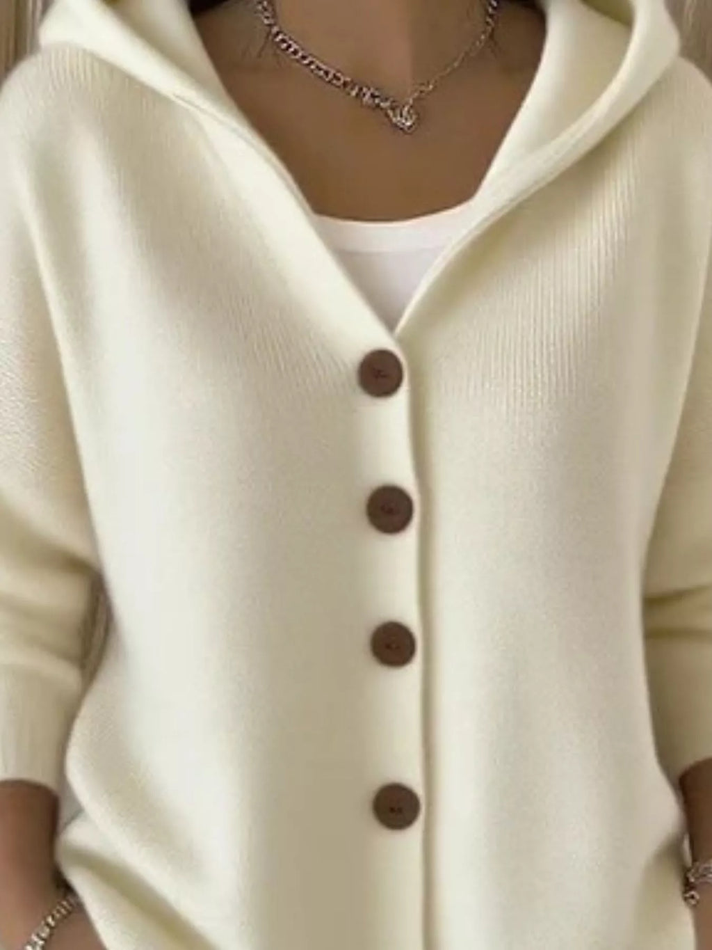 Beige hooded knit cardigan with button-front placket and long sleeves