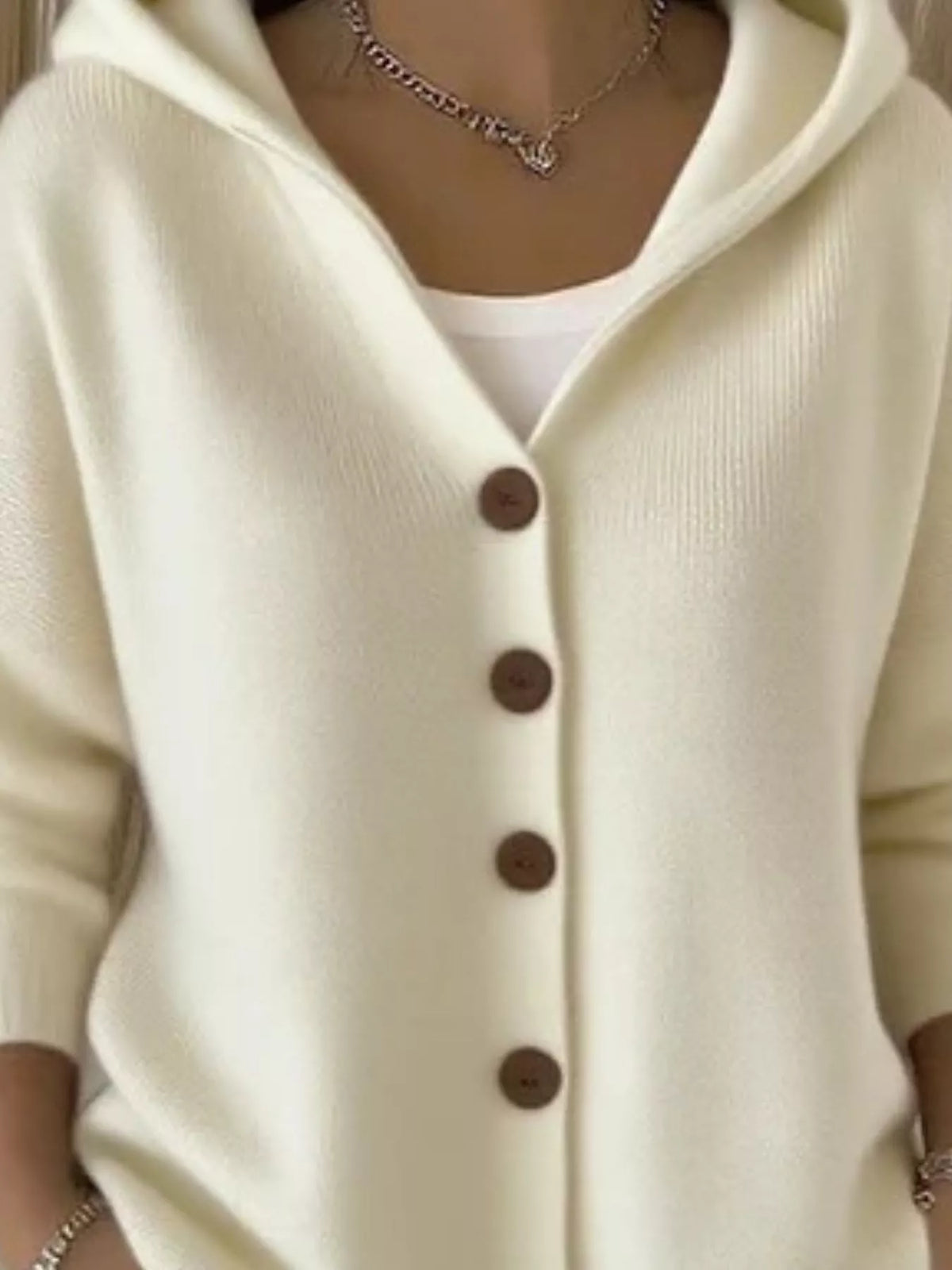 Beige hooded knit cardigan with button-front placket and long sleeves