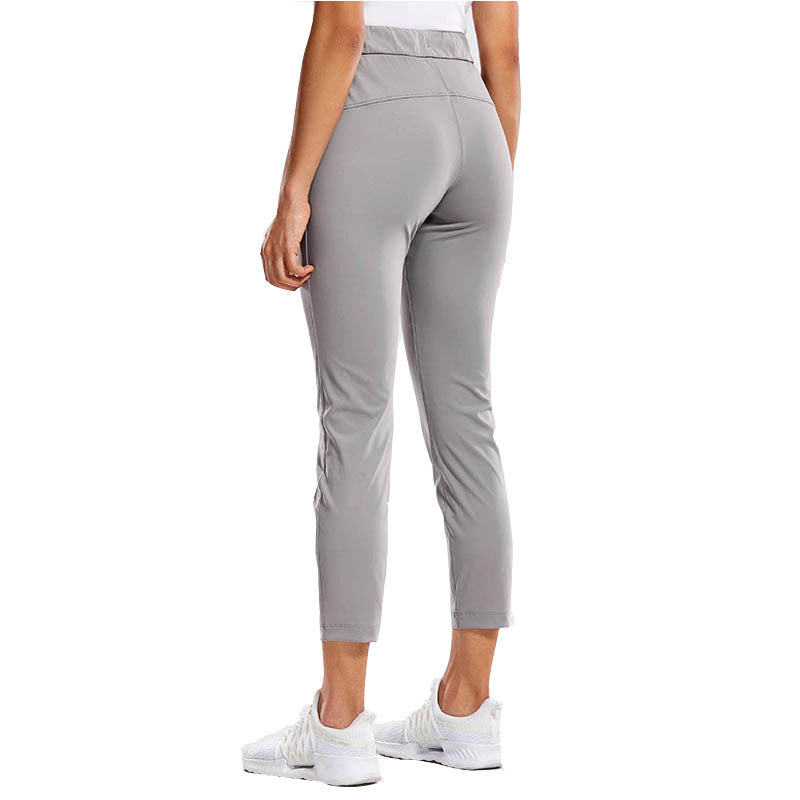 Women's grey slim-fit drawstring ankle pants, side view
