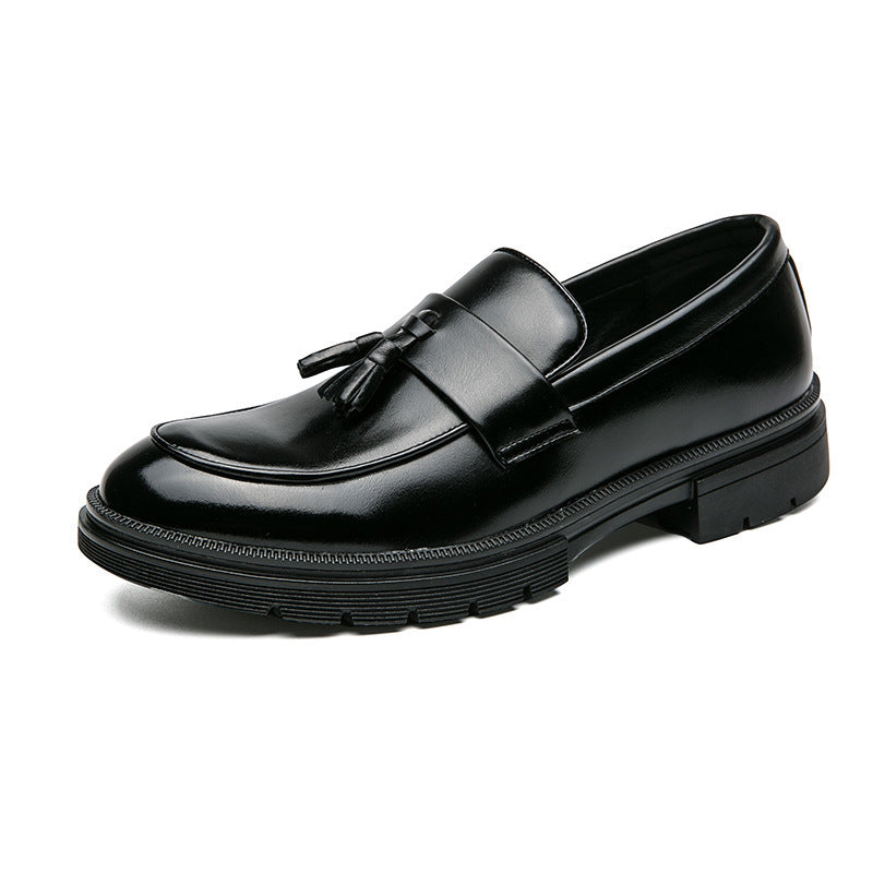 Black leather tassel loafers with wide strap and thick rubber sole