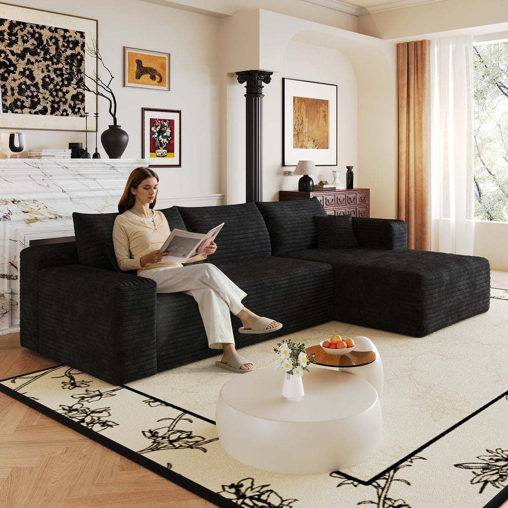 Dark plush corduroy sectional sofa with wide chaise and back cushions