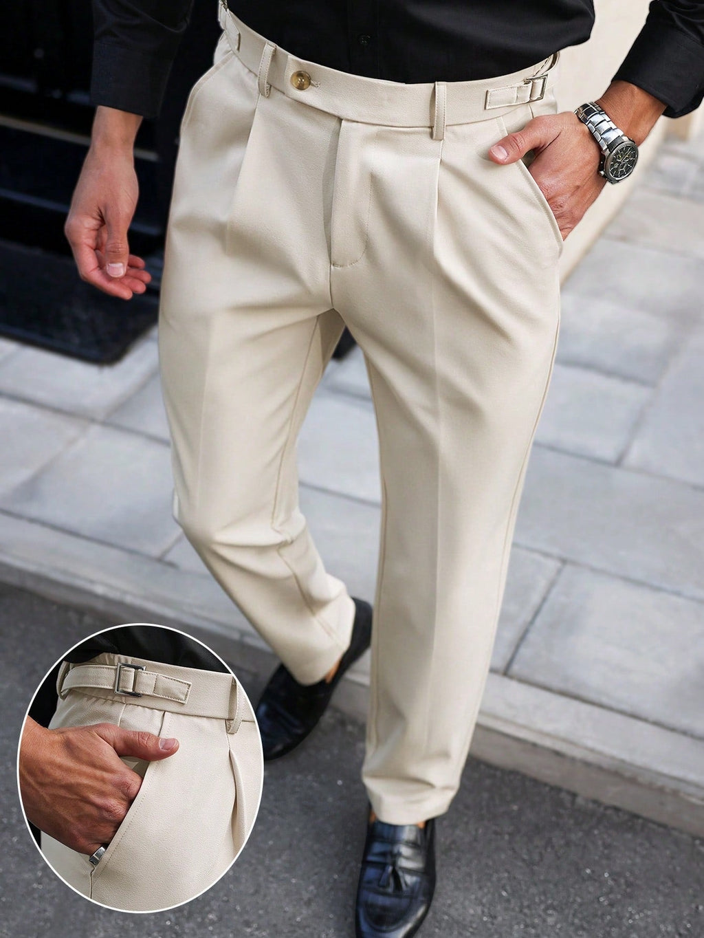 Light beige straight-leg trousers with belt loops, button fly, and front pleat details