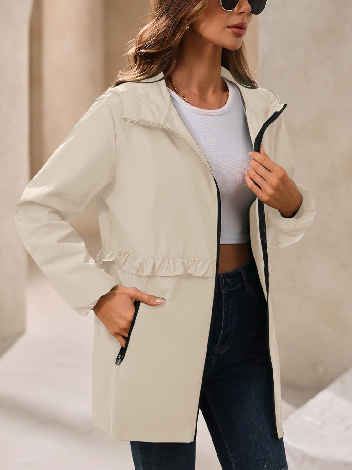 Tan hooded windbreaker jacket with zip front and gathered waist, side detail