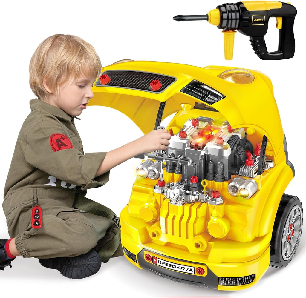 Toddler seated by yellow toy truck builder, hands on engine parts, drill accessory