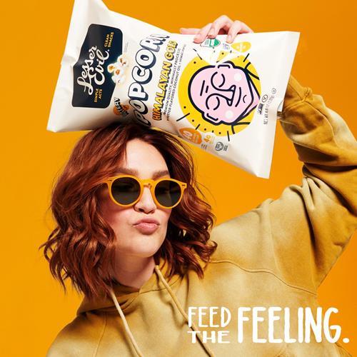 Organic Himalayan gold popcorn bag held in hand