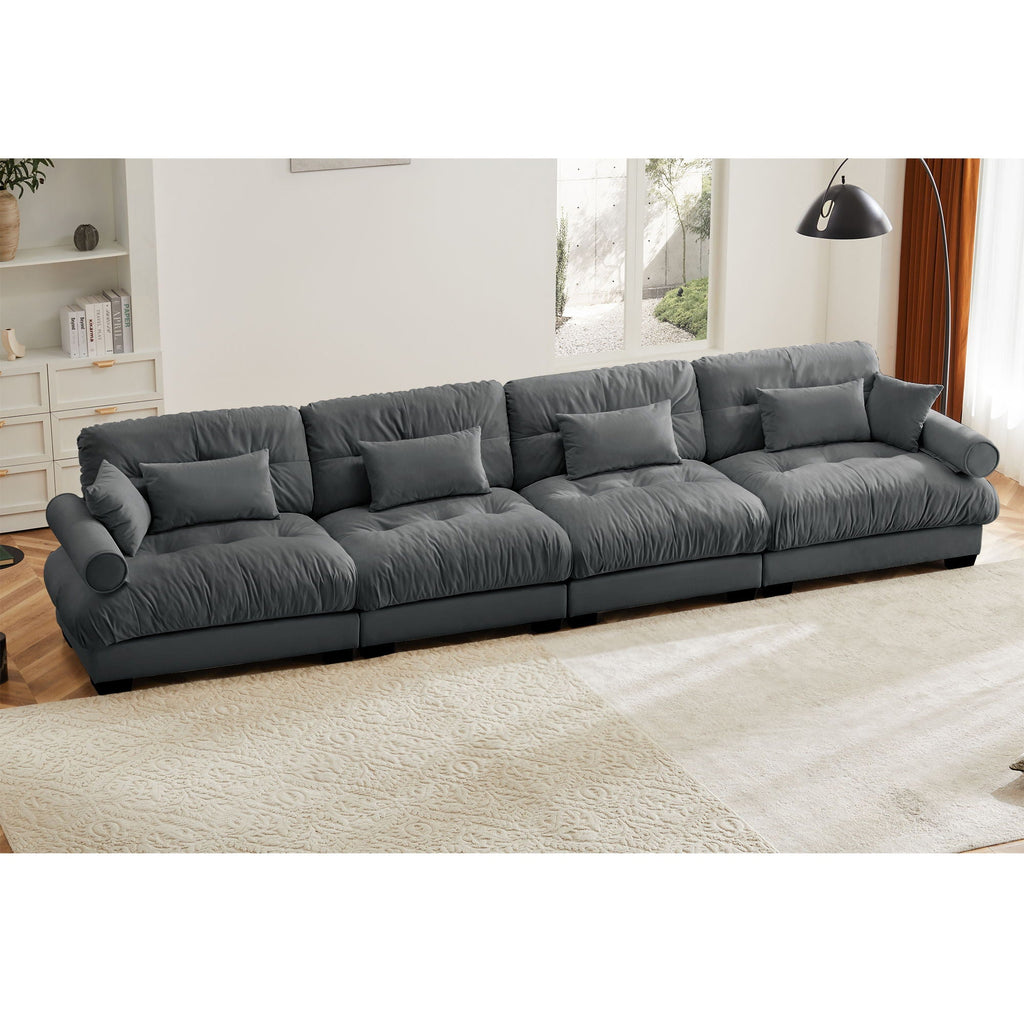 Dark gray modular L-shaped sectional sofa in living room, deep seats and back cushions