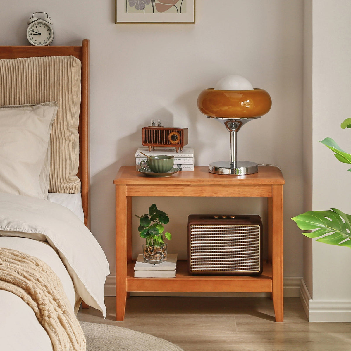 Two-tier wooden side table with a warm brown finish and open storage shelf