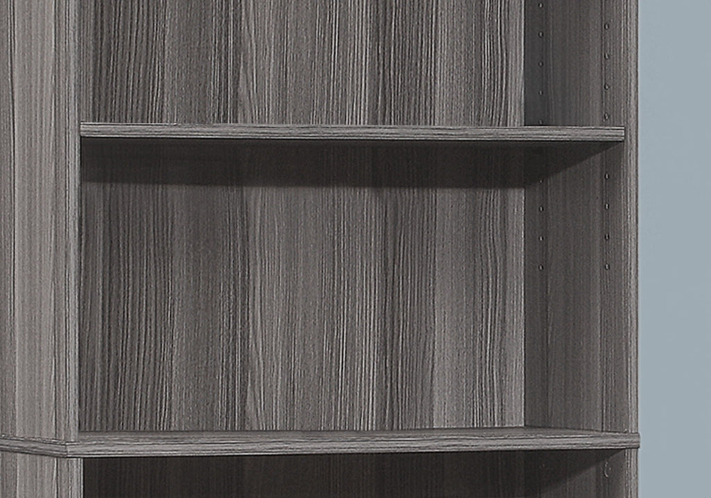 Close-up of dark gray wood-grain bookcase panel
