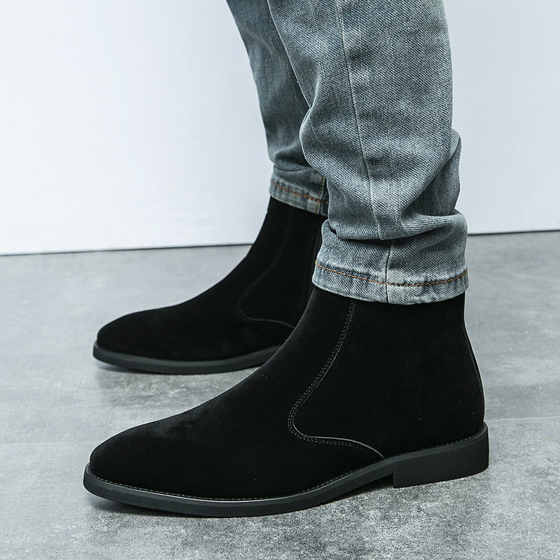 Black suede chelsea ankle boots with elastic side gore and dark sole, side view