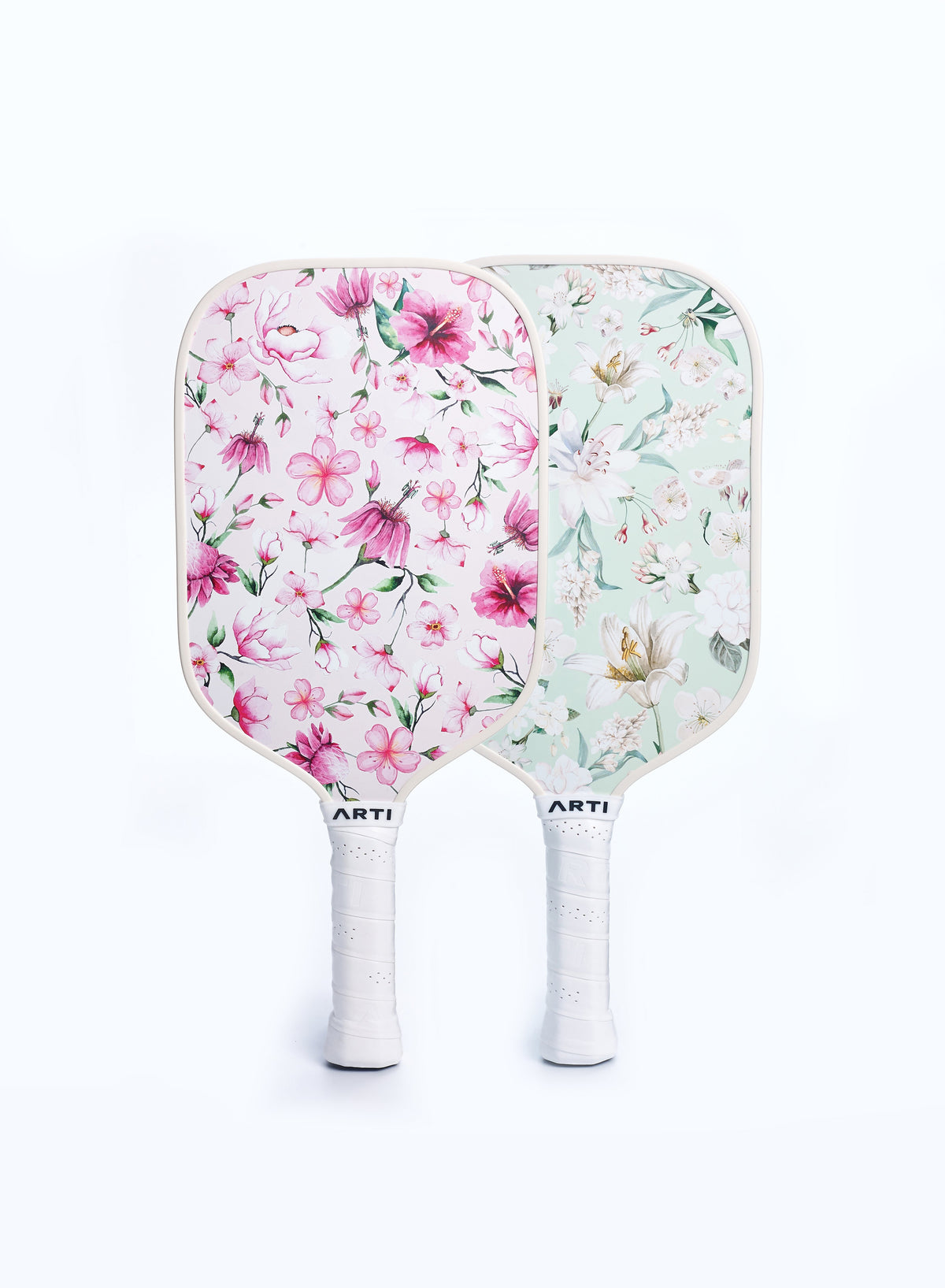 Floral pickleball paddle set with two ARTI paddles and white grip handles