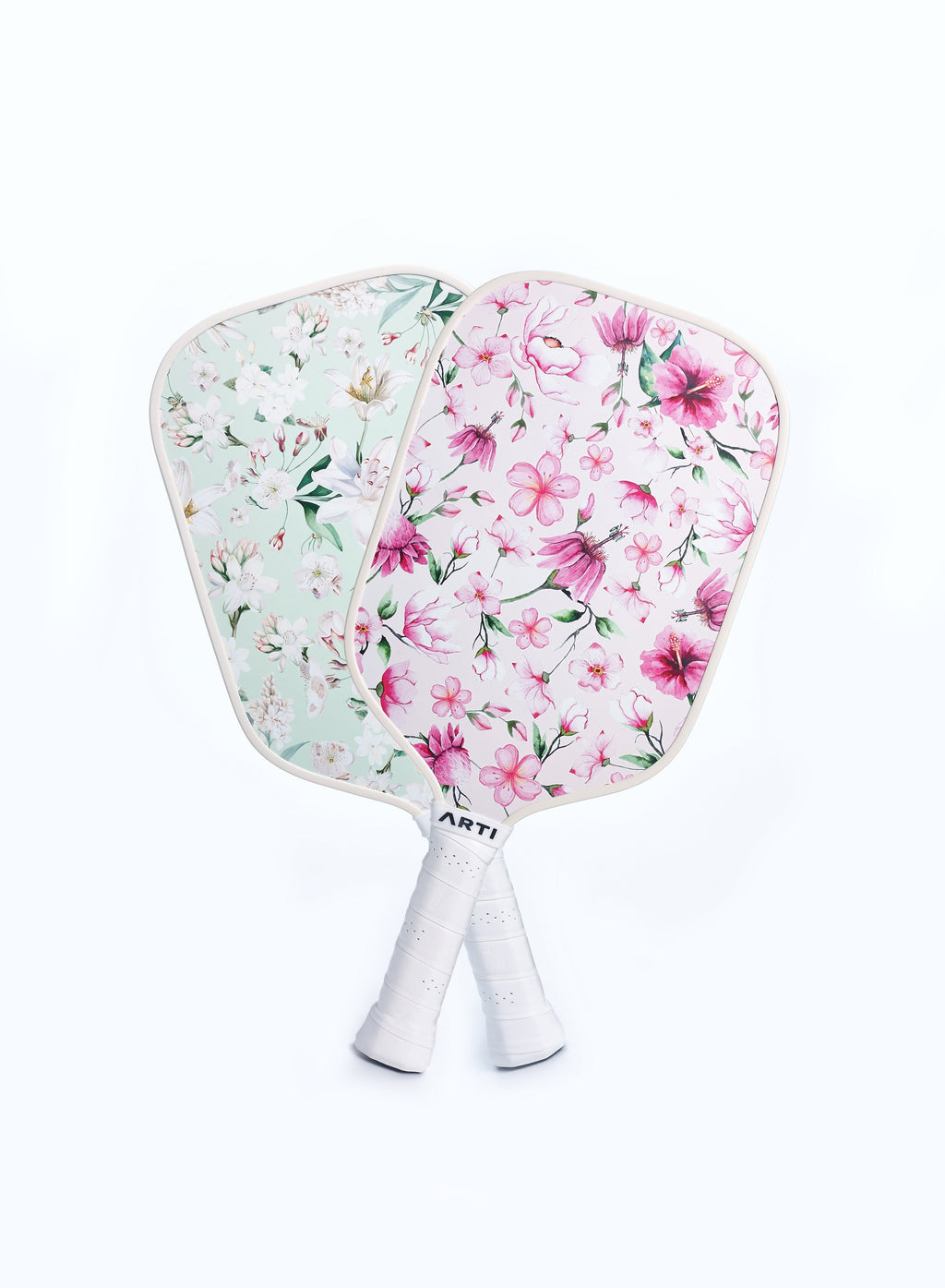 Floral pickleball paddle pair with two paddles and white handles, ARTI