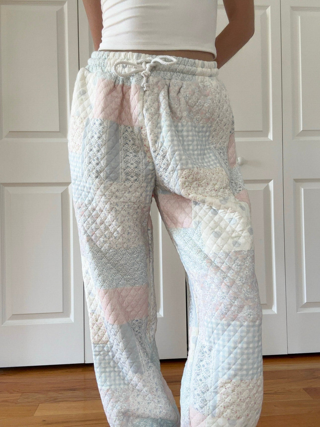 Quilted pastel jogger pants with elastic drawstring waist and diamond pattern in light blue
