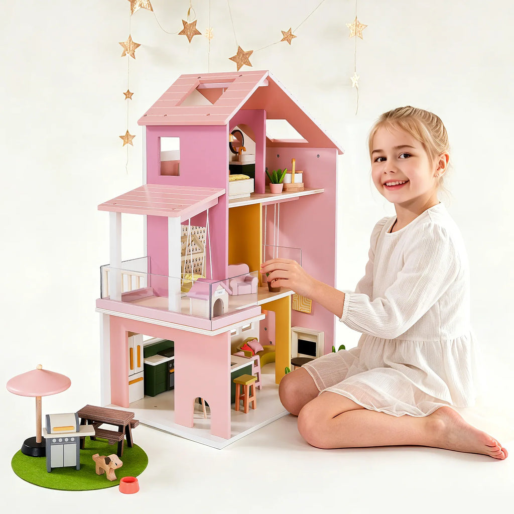 Pink dollhouse with stacked floors, staircase, and rooftop balcony detail