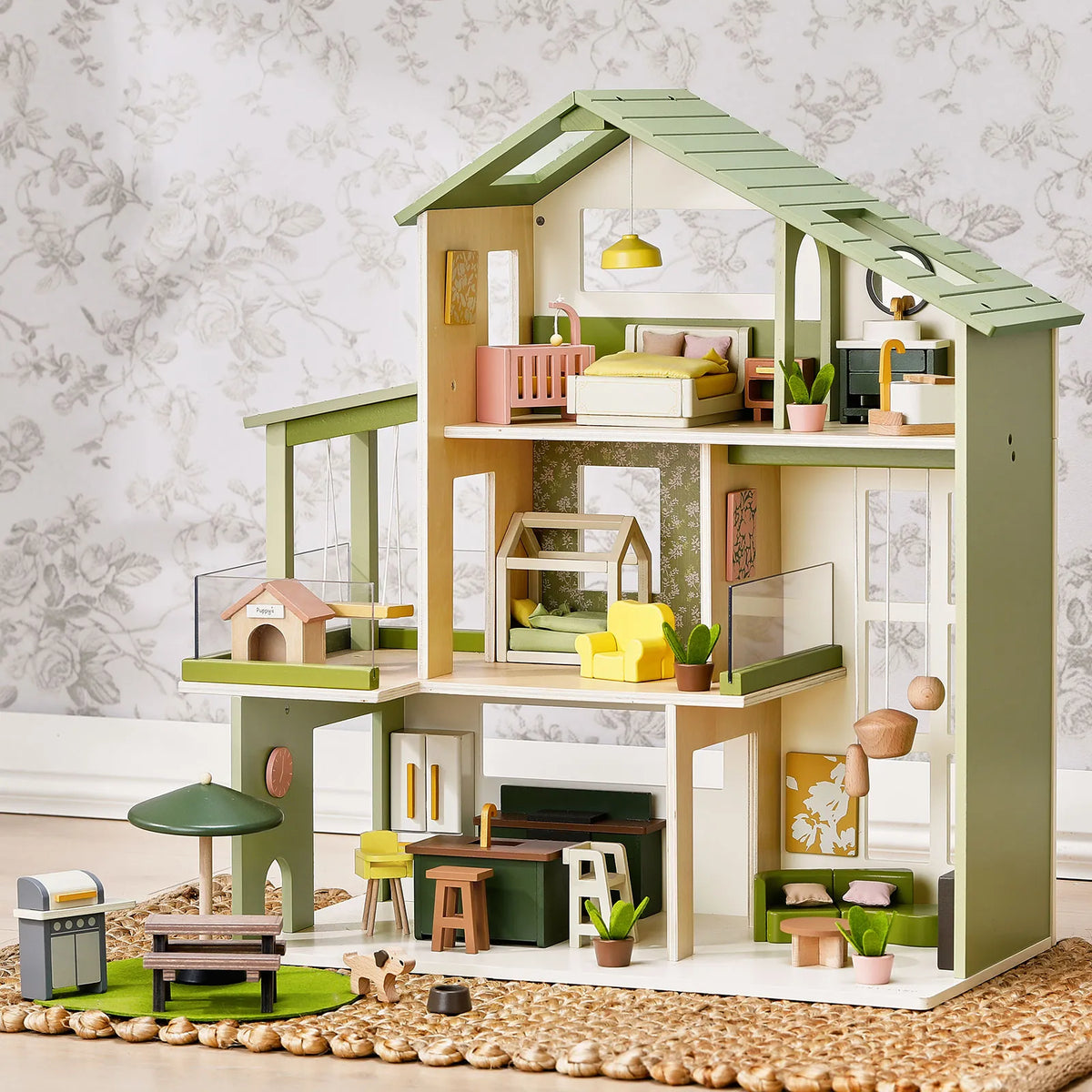 Tiny Land dollhouse with green roof, pastel rooms, and furnished multi-level interior play set