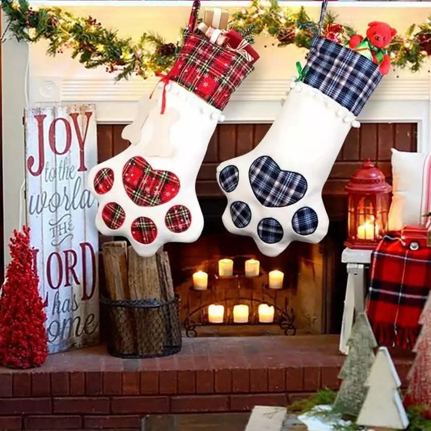 Pet paw hanging Christmas stockings: red plaid and blue plaid cuffs with white paw patches
