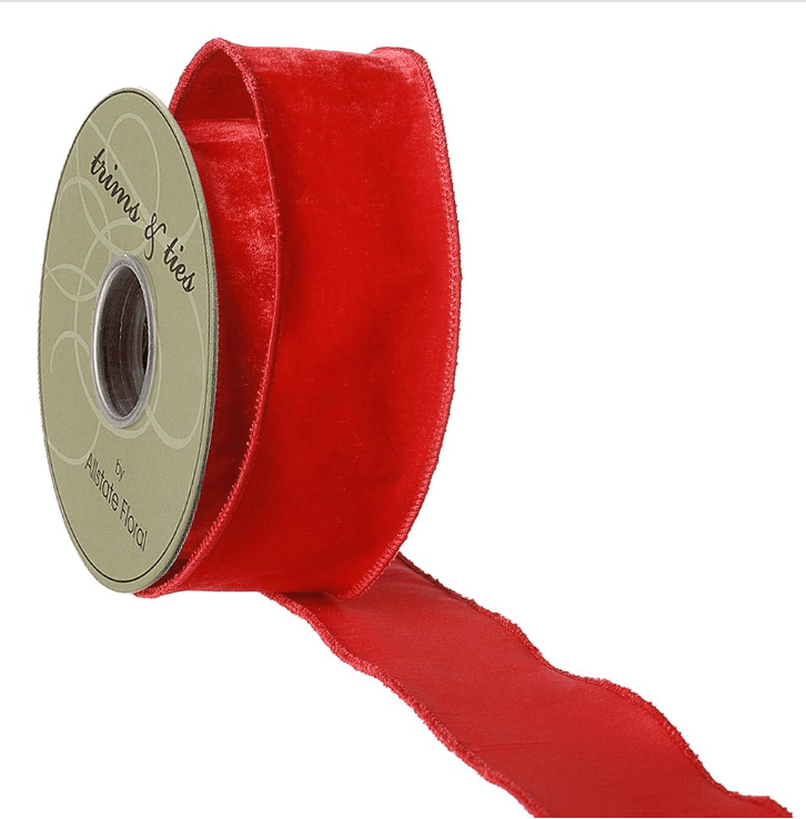 Red velvet ribbon roll with free length, visible edge trim