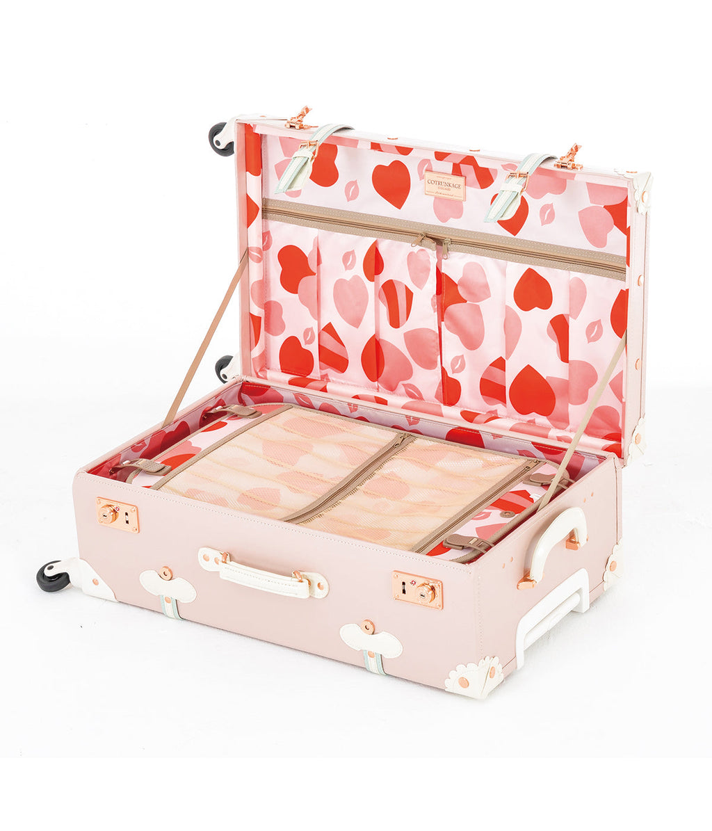 Cherry pink train case with heart-pattern lining, open lid and storage compartments
