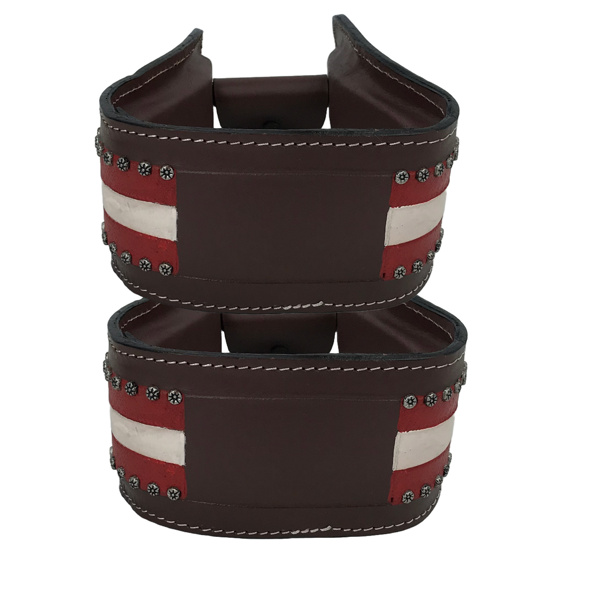 Pair of brown leather stirrups with wide red-white stripe panels and star details
