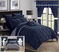 Navy reversible comforter set with quilted bedspread, pillows, and matching shams