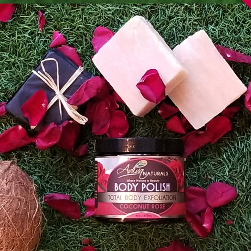 Coconut Rose body polish scrub jar with wrapped soap bars and pink rose-shaped soaps