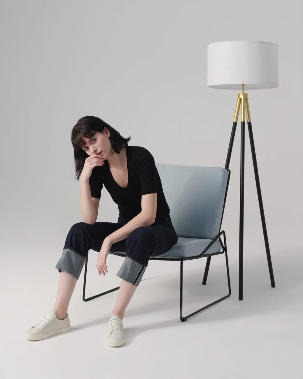Levi floor lamp with white shade and black tripod base