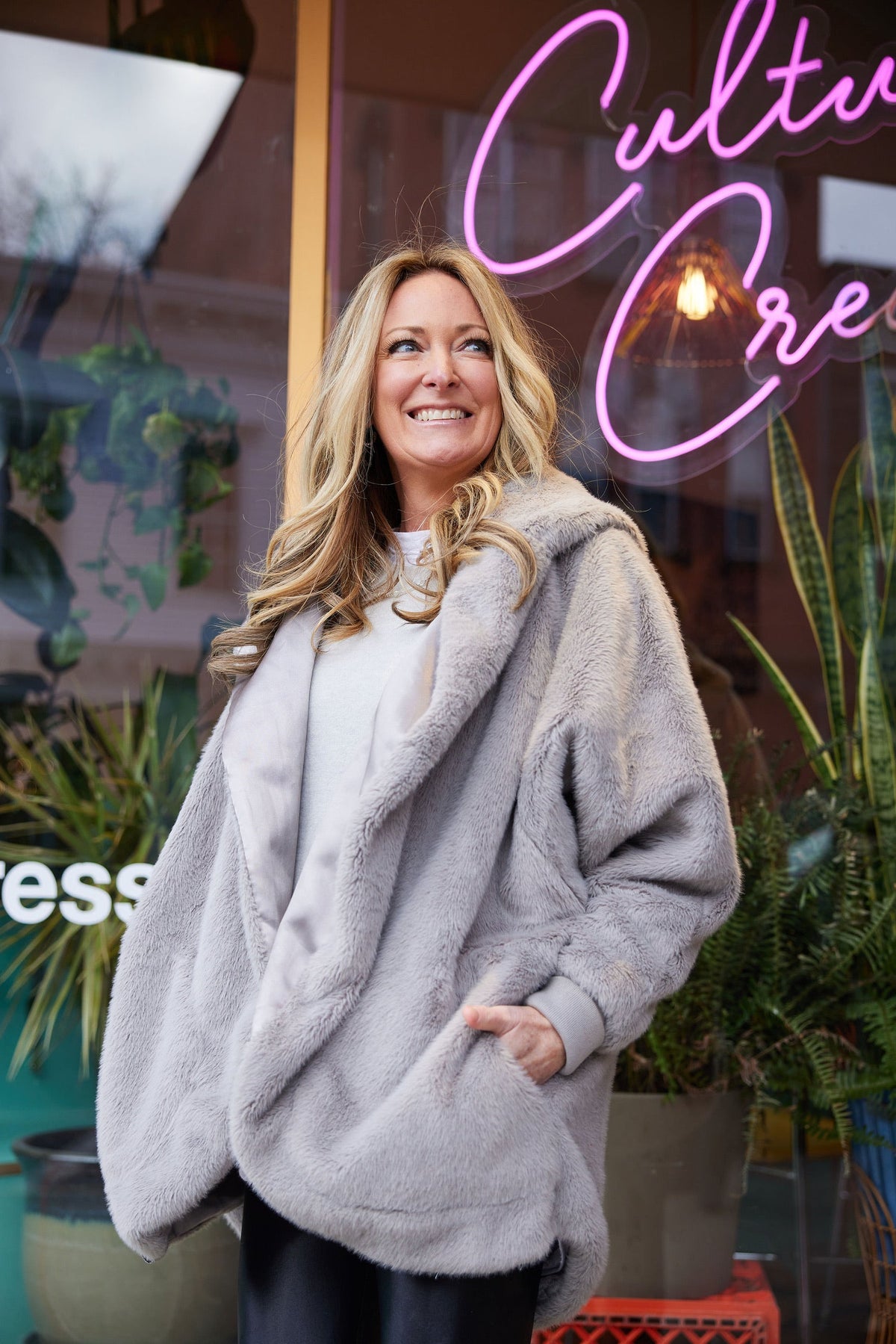 Grey waterproof hooded cardigan with zip front and plush faux-fur texture