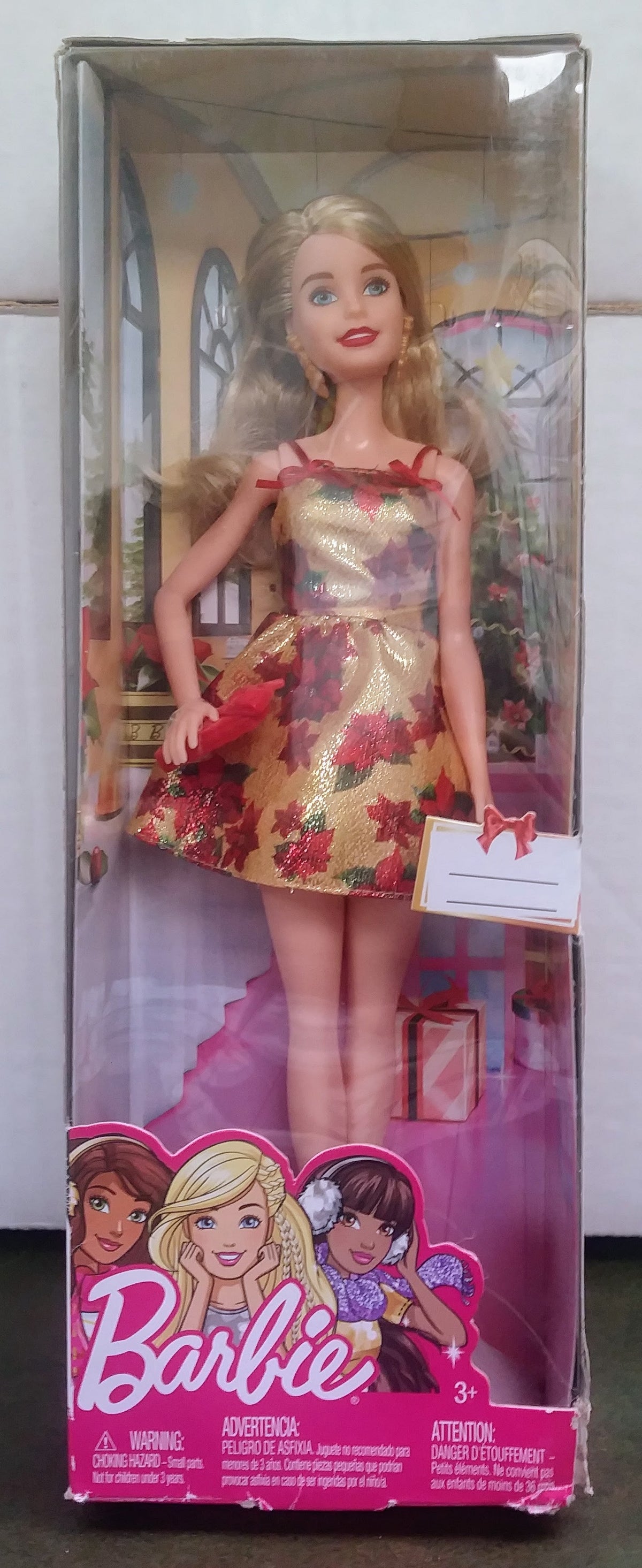 Barbie Holiday Barbie fashion doll in festive pink and gold dress, in box