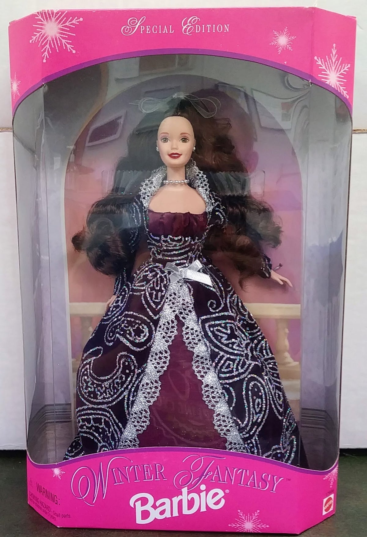 Winter Fantasy Barbie doll in dark purple and black patterned gown with fur trim