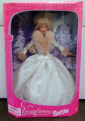 Barbie doll in white winter dress with faux-fur shrug and gloves