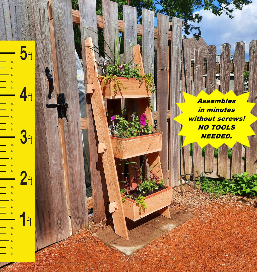 3-tier vertical cedar standing planter box with three terracotta-orange planting containers